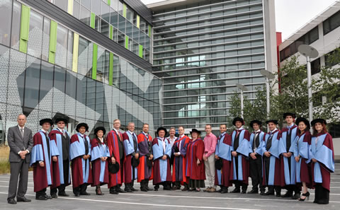 ORC graduates and staff stand outside the Mountbatten Building and Cleanroom Complex